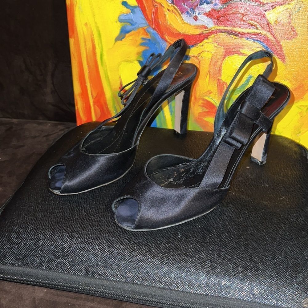 Kate spade black satin peep toe, slide in, sling back, with bow by the ankle.